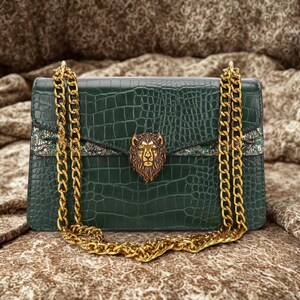 Fashionable green chain shoulder bag with glossy croc embossed finish and trendy Y2K aesthetic appearance