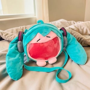 May include: A set of three ceramic mugs with a speckled, matte finish. The mugs are in shades of cream, light gray, and dark gray. Each mug has a simple, modern design and a rounded handle.