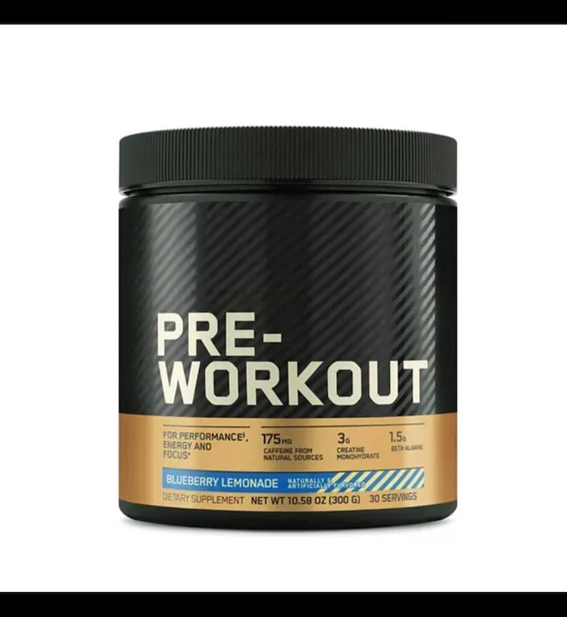 May include: A black pre-workout supplement container with a textured pattern. The label features the words "PRE-WORKOUT" in large white letters, along with details about ingredients and flavor, "Blueberry Lemonade". The container weighs 10.58 oz (300 g).