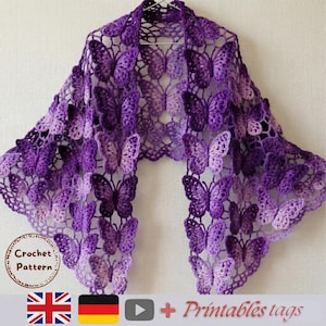 May include: A purple crocheted shawl with a butterfly pattern. The shawl is made of a delicate, open-weave fabric, with numerous butterfly motifs throughout. The text "Crochet Pattern" is visible in the image.