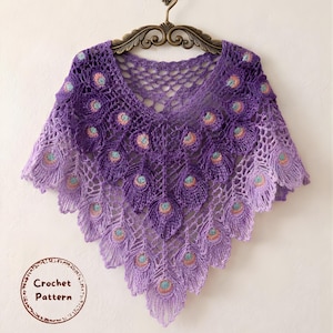 May include: A handmade, purple crochet shawl with a peacock feather design. The shawl features a V-neck and is adorned with detailed, layered feather motifs in shades of purple, with accents of pink and teal. The words "Crochet Pattern" are in a circle.