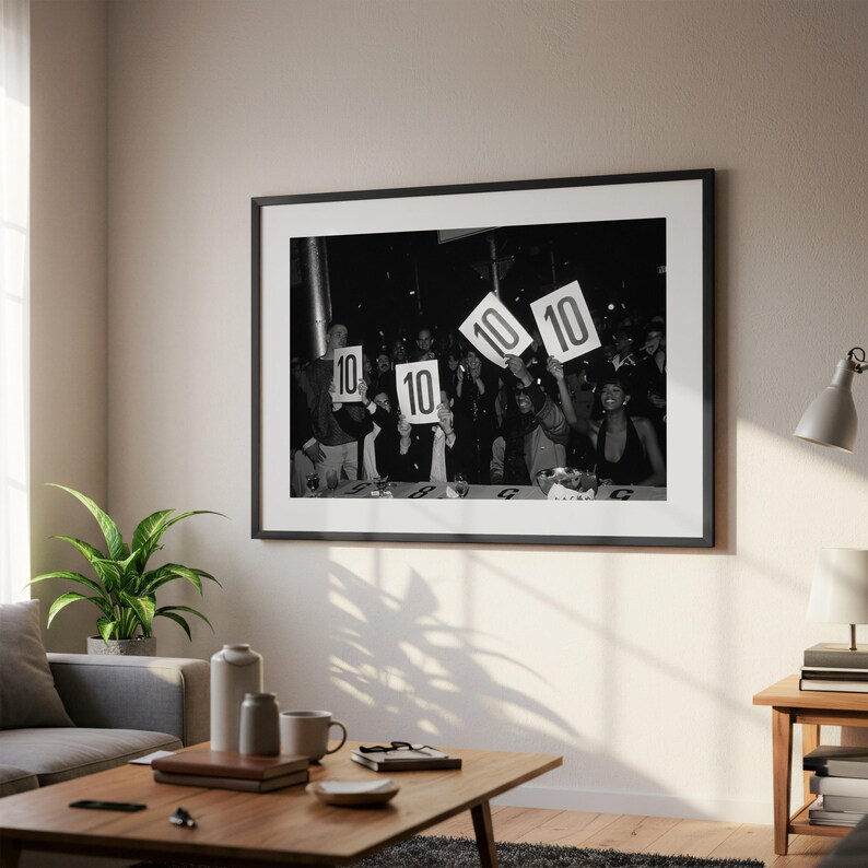 a black and white photograph of a group of people holding up signs with the numbers "10" and "10" on them, suggesting they are participating in a contest or event.