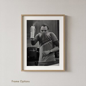 May include: A set of three ceramic mugs with a speckled, matte finish. The mugs are in shades of cream, light grey, and dark grey. Each mug has a simple, minimalist design, ideal for coffee or tea.