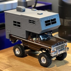 May include: A rustic wooden sign with the text "Welcome to our home" in white lettering. The sign features a distressed finish and a simple, inviting design, perfect for front door decor.