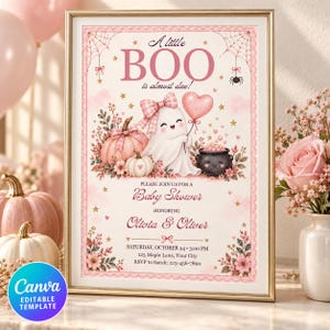 May include: A framed baby shower invitation featuring a pink ghost with a bow, a heart balloon, pumpkins, and a cauldron. The text reads: A little BOO is almost due! PLEASE JOIN US FOR A Baby Shower HONORING Olivia & Oliver SATURDAY, OCTOBER 24 &bull; 3:00 PM 123 Maple Lane, Your City RSVP to Sarah: 123-456-7890.