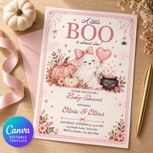 May include: A rectangular baby shower invitation card featuring a pink and white theme with a ghost wearing a bow, a heart balloon, a pumpkin, and a cauldron. The text reads A little BOO is almost due, Baby Shower, Olivia & Oliver, and event details.