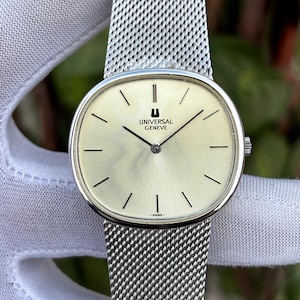 Reloj suizo vintage Universal Geneve "Ellipse" con esfera tipo rayos de sol y cuerda manual, modelo 842125