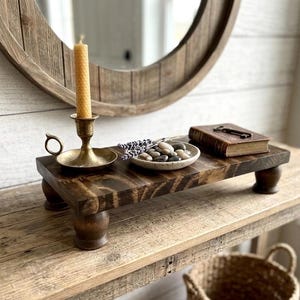 May include: A set of three ceramic mugs with a speckled, matte finish. The mugs are in shades of cream, light gray, and dark gray. Each mug has a simple, minimalist design, perfect for coffee or tea.