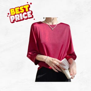 May include: A crimson blouse with three-quarter sleeves and a round neckline. The top has a silky sheen. The image also includes the text "BEST PRICE" in a yellow and red design.