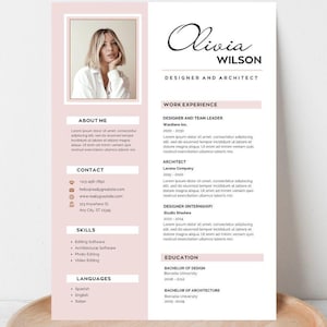 May include: A resume template with a photo, the name "Olivia Wilson", and the title "Designer and Architect". The resume has sections for work experience, skills, and education, with a soft pink color scheme. It is displayed on a wooden tray.