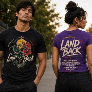 May include: Black t-shirt with a rose graphic in yellow, green, and red, and the words "Land Back." A purple t-shirt with "Land Back" and text: "More than words. More than a movement..."