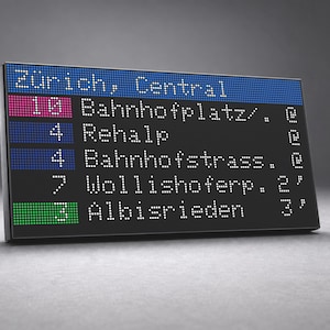 Könnte beinhalten: Eine rechteckige digitale Anzeigetafel mit schwarzem Hintergrund und weißer Schrift. Der obere blaue Balken zeigt Zürich, Central. Darunter befinden sich Zeilen mit den Linien 10, 4, 4, 7 und 3 sowie den Zielen Bahnhofplatz, Rehalp, Bahnhofstrass, Wollishoferp und Albisrieden.
