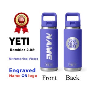 May include: Two Ultramarine Violet YETI Rambler 2.0® bottles. One has the name engraved vertically, the other has a silver circle with "YOUR DESIGN HERE". Both have a handle and the YETI logo.