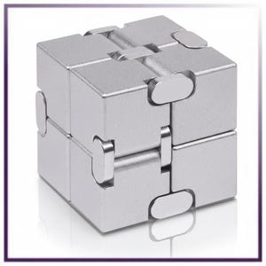 May include: A silver-colored infinity cube fidget toy composed of eight smaller connected cubes. The metallic surface has a smooth finish, and the individual segments are joined by visible hinges that allow the object to fold and change shape.