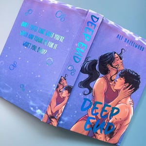 May include: A hardcover book titled Deep End by Ali Hazelwood with a purple cover featuring an illustration of two people embracing underwater. The back cover includes the text: Quiet, you'll take what you're given and thank me for it. Won't you, baby?