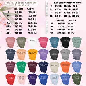 May include: A size chart for adult unisex crewneck t-shirts, youth, and toddler sizes. The chart displays measurements in inches for length and width, along with the sizes. Various t-shirt colours are shown, including heather mauve, navy, and red.