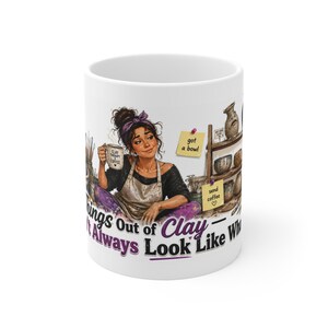 May include: A white ceramic mug featuring a graphic illustration of a potter wearing an apron and a purple headband. The design includes shelves with pottery, sticky notes reading got a bowl and send coffee, and text that reads Things Out of Clay Don't Always Look Like What.