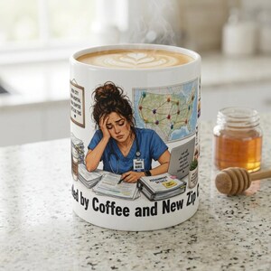 May include: White ceramic mug with a detailed illustration of a nurse looking stressed, surrounded by paperwork and a laptop. The mug has the text "fueled by Coffee and New Zip Codes". A small jar of honey and a honey dipper are next to the mug.