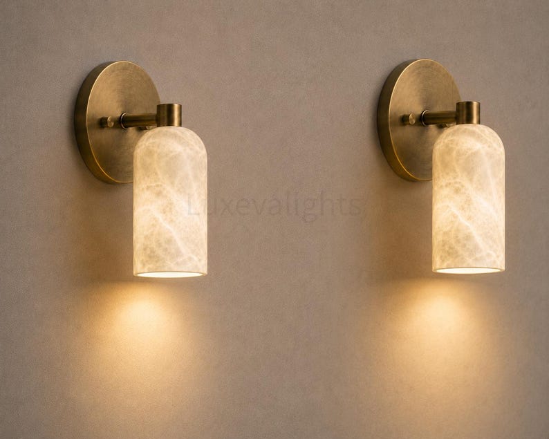 Pair of modern natural alabaster wall sconces in solid antique brass, luxury mid century wall lights for bathroom vanity, bedroom bedside, hallway and living room
Mid century modern solid brass wall sconces with glowing natural alabaster shades for elegant home lighting
Contemporary antique brass wall sconces with natural alabaster cylinder shades, luxury interior wall lighting
Modern alabaster wall sconce pair in solid brass, luxury mid century wall lighting for bedroom and bathroom vanity