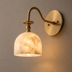 Modern alabaster wall sconce pair in antique brass, luxury bathroom vanity wall light fixture with natural stone shades
Handmade alabaster wall sconces with antique brass finish, mid century modern bathroom vanity lighting pair
Luxury brass wall sconce pair featuring natural alabaster shades for modern bathroom vanity lighting
Mid century modern alabaster wall light pair in antique brass, handcrafted bathroom vanity sconces
Pair of antique brass alabaster wall sconces with warm lighting