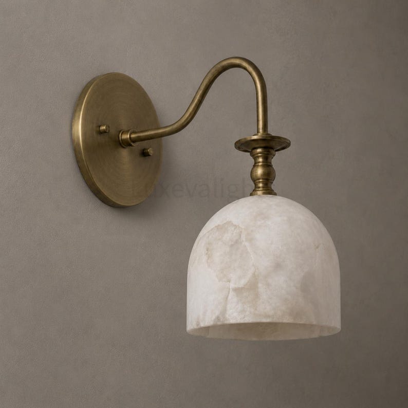 Pair of modern alabaster wall sconces with antique brass finish, handcrafted mid century bathroom vanity wall lights on a warm beige textured wall
Modern alabaster wall sconce pair in antique brass, luxury bathroom vanity wall lights with natural stone shades
Handmade brass alabaster wall sconces, mid century modern bathroom vanity lighting with warm ambient glow
Luxury antique brass wall sconces featuring natural alabaster shades, perfect for bathroom vanity or hallway lighting
brass wall light