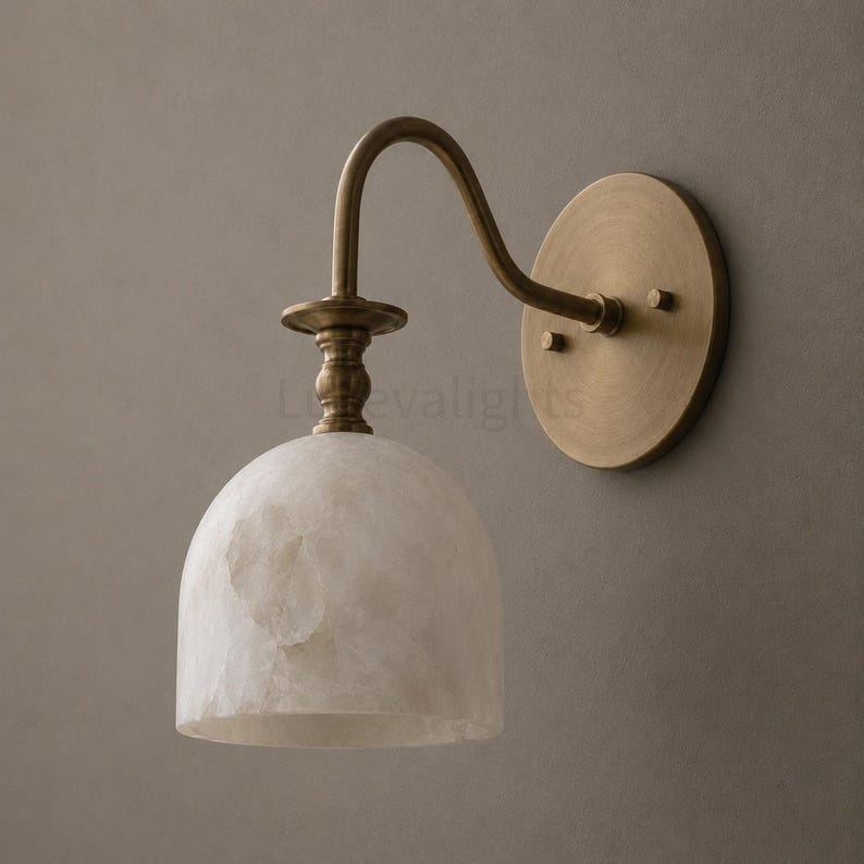 Pair of modern alabaster wall sconces with antique brass finish, handcrafted mid century bathroom vanity wall lights on a warm beige textured wall
Pair of handcrafted alabaster brass wall lights, modern mid century wall sconces for bathroom, bedroom, or entryway
Modern brass wall sconce pair with natural alabaster shades, elegant luxury bathroom vanity lighting fixture
Antique brass alabaster wall light fixture, handmade modern wall sconces with warm illumination for luxury interiors