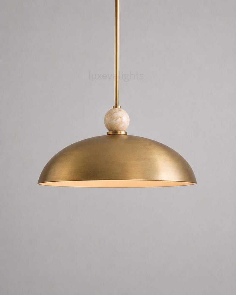 Minimalist chrome dome pendant lamp inspired by vintage Italian modern design, elegant ceiling light for modern home decor
Handmade chrome dome hanging light with warm ambient glow, mid century modern kitchen island lighting fixture
Large polished chrome pendant light with sleek dome shade and alabaster ball accent, luxury modern ceiling fixture
Scandinavian modern chrome dome ceiling light with minimalist hanging rod and soft warm interior lighting aesthetic
Retro futuristic chrome pendant lamp