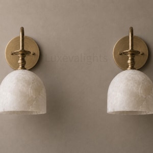 Modern alabaster wall sconce pair in antique brass, luxury bathroom vanity wall light fixture with natural stone shades
Handmade alabaster wall sconces with antique brass finish, mid century modern bathroom vanity lighting pair
Luxury brass wall sconce pair featuring natural alabaster shades for modern bathroom vanity lighting
Mid century modern alabaster wall light pair in antique brass, handcrafted bathroom vanity sconces
Pair of antique brass alabaster wall sconces with warm lighting