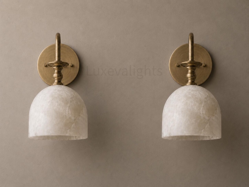Modern alabaster wall sconce pair in antique brass, luxury bathroom vanity wall light fixture with natural stone shades
Handmade alabaster wall sconces with antique brass finish, mid century modern bathroom vanity lighting pair
Luxury brass wall sconce pair featuring natural alabaster shades for modern bathroom vanity lighting
Mid century modern alabaster wall light pair in antique brass, handcrafted bathroom vanity sconces
Pair of antique brass alabaster wall sconces with warm lighting