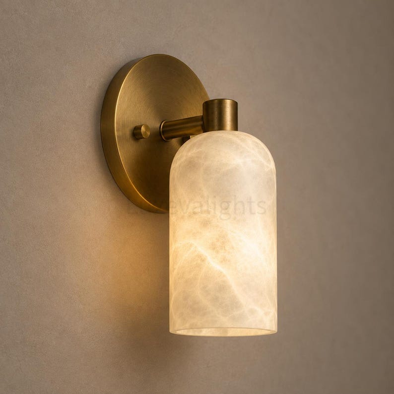 Pair of modern natural alabaster wall sconces in solid antique brass, luxury mid century wall lights for bathroom vanity, bedroom bedside, hallway and living room
Modern antique brass alabaster wall sconce pair with warm lighting for luxury bathroom vanity and bedroom decor
Handmade solid antique brass wall sconces with natural alabaster shades, modern mid century wall lighting
Luxury natural alabaster wall light pair in antique brass finish for bathroom vanity, bedside and hallway lighting