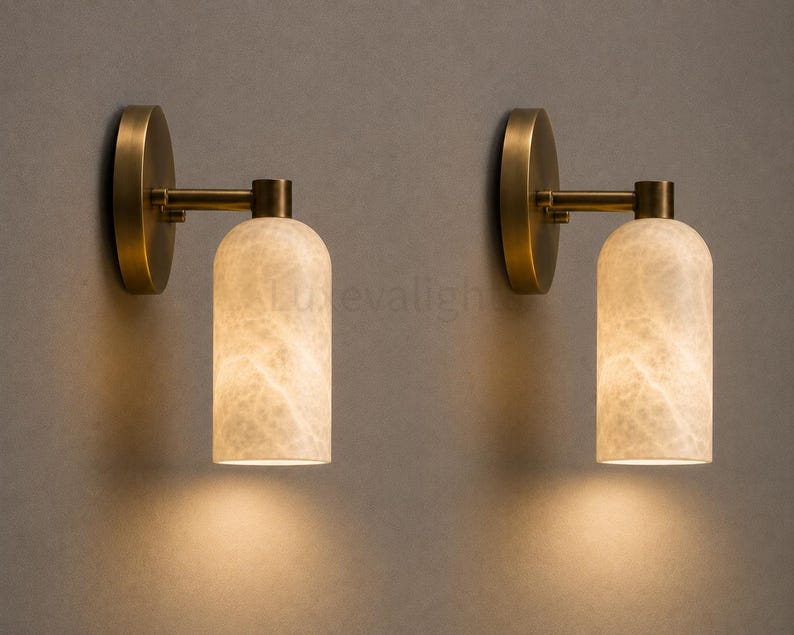 Pair of modern natural alabaster wall sconces in solid antique brass, luxury mid century wall lights for bathroom vanity, bedroom bedside, hallway and living room
Mid century modern solid brass wall sconces with glowing natural alabaster shades for elegant home lighting
Contemporary antique brass wall sconces with natural alabaster cylinder shades, luxury interior wall lighting
Modern alabaster wall sconce pair in solid brass, luxury mid century wall lighting for bedroom and bathroom vanity