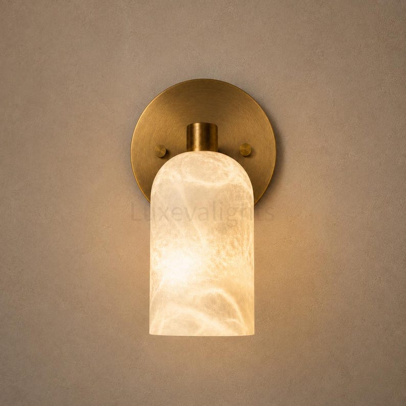 Natural alabaster cylinder wall sconces in antique brass, designer lighting for bedroom, hallway and living room
Minimalist antique brass wall sconces with glowing alabaster shades for modern home decor
Contemporary solid brass alabaster wall light pair for luxury bathroom vanity and bedside lighting
Elegant natural alabaster wall sconces with antique brass backplate, handcrafted modern wall lighting
Premium antique brass wall sconces with natural alabaster shades for luxury interior lighting