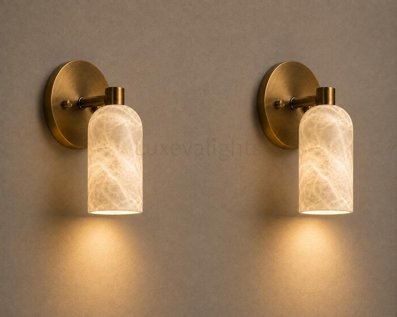 Pair of modern natural alabaster wall sconces in solid antique brass, luxury mid century wall lights for bathroom vanity, bedroom bedside, hallway and living room
Modern antique brass alabaster wall sconce pair with warm lighting for luxury bathroom vanity and bedroom decor
Handmade solid antique brass wall sconces with natural alabaster shades, modern mid century wall lighting
Luxury natural alabaster wall light pair in antique brass finish for bathroom vanity, bedside and hallway lighting