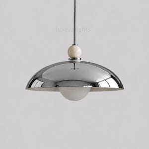 Mid Century Modern Chrome Dome Pendant Light, Italian Modern Hanging Lamp, Luxury Kitchen Island Lighting, Alabaster Ball Ceiling Fixture
Luxury chrome dome pendant lighting fixture in 1950s mid century modern style with natural alabaster accent and minimalist design
Italian modern chrome hanging lamp with large metallic dome shade, minimalist kitchen island pendant light for luxury interiors
Modern chrome ceiling pendant light with alabaster sphere detail, contemporary dome hanging fixture