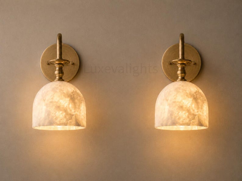 Pair of modern alabaster wall sconces with antique brass finish, handcrafted mid century bathroom vanity wall lights on a warm beige textured wall
Modern alabaster wall sconce pair in antique brass, luxury bathroom vanity wall lights with natural stone shades
Handmade brass alabaster wall sconces, mid century modern bathroom vanity lighting with warm ambient glow
Luxury antique brass wall sconces featuring natural alabaster shades, perfect for bathroom vanity or hallway lighting
brass wall light