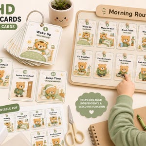 May include: ADHD routine cards with 30 printable cards. The cards feature a bear character and are designed for kids. The image includes a morning routine board and a stack of cards with illustrations. The text on the cards includes "Wake Up" and "Sleep Time".