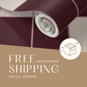 May include: A roll of wallpaper featuring a repeating grid pattern of deep burgundy and off-white squares. The surface has a subtle, textured appearance, and the roll is partially unspooled, revealing the layered structure of the material.