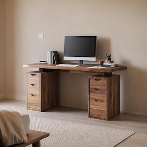 May include: A modern wooden desk with a computer monitor, keyboard, and office supplies. The desk has two sets of drawers and a light-colored rug in front. The desk is made of dark wood with a visible wood grain.