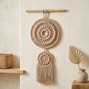 May include: A white ceramic mug with a black handle and the text "But First, Coffee" in a black, handwritten-style font. The mug is on a white surface.