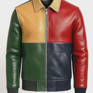 May include: A multi-coloured leather jacket with a zip-up front. The jacket is divided into four sections of green, yellow, red, and navy blue. It has a collared neckline and ribbed cuffs and hem. The design is striking and bold.