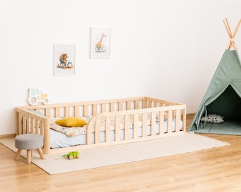 Cama infantil a ras de suelo (con abertura redonda en un lateral y esquinas redondeadas)