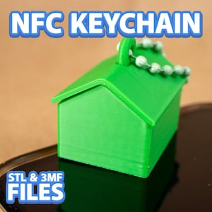 May include: A green NFC keychain shaped like a house, with a small loop and a chain of white beads. The text "NFC KEYCHAIN" is at the top, and "STL & 3MF FILES" is at the bottom. The keychain is on a dark surface.