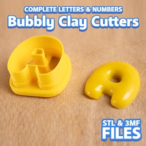 May include: Yellow plastic clay cutters in the shape of the letter "A". The cutters are labeled "Bubbly Clay Cutters" and "Complete Letters & Numbers". The image also includes the text "STL & 3MF FILES".