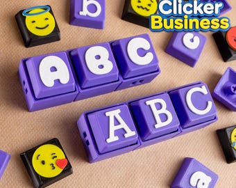 Può includere: Blocchi dell'alfabeto viola e bianchi che compongono "ABC" e altri blocchi di lettere individuali. Alcuni blocchi presentano faccine emoji. L'immagine include anche il testo "Fidget Clicker Business".