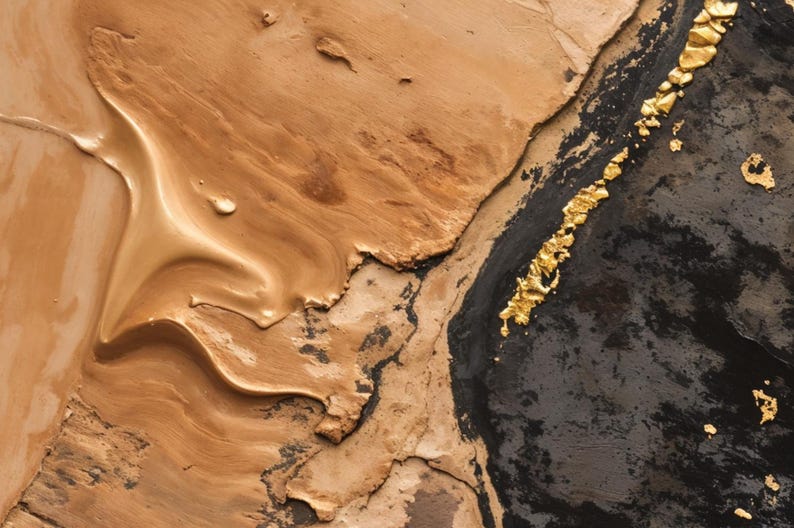 May include: An abstract painting featuring a thick, textured application of beige and tan paint on the left side, transitioning into a deep black section on the right, accented by a vertical line of metallic gold leaf flakes and textured gold paint.
