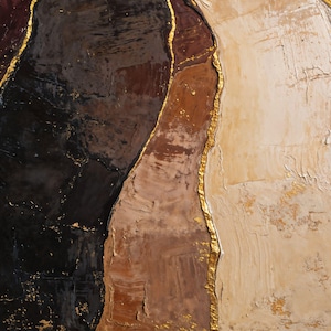 May include: An abstract painting featuring thick, textured layers of paint in deep black, dark burgundy, warm brown, and creamy beige. The distinct color sections are separated by irregular, raised lines of metallic gold leaf accents.