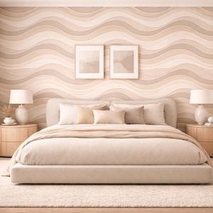 May include: A bedroom interior with a neutral colour scheme. The bed has beige bedding and pillows, with a matching headboard. Two framed pictures are above the bed. Two wooden bedside tables with lamps flank the bed. The wall has a wavy pattern.