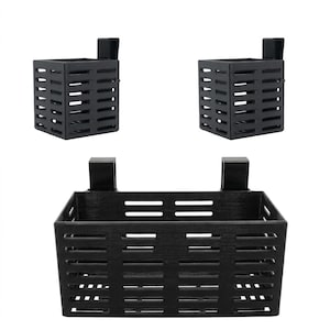 May include: Three black metal storage baskets. Two smaller square baskets and one larger rectangular basket. All have a slotted design and a hook for hanging. Perfect for organizing items.