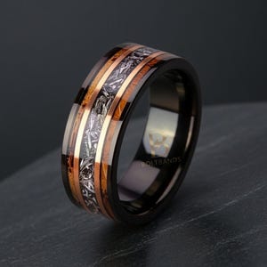 May include: A rustic wooden sign with the text "Welcome to our home" in white lettering. The sign has a distressed finish and a simple, inviting design, suitable for a front porch or entryway.