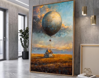 Puede incluir: Una impresión de arte mural vertical enmarcada que representa un gran globo aerostático texturizado en tonos metálicos flotando sobre una pequeña casa en un vasto campo de color marrón dorado bajo un cielo dramático con nubes naranjas y azules.